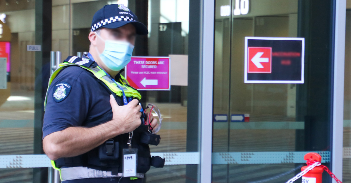 Victoria Police Officer Wearing Mask Outside Building